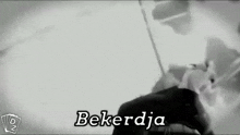 a black and white photo of a man with the word bekerdja on the bottom