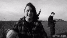a black and white photo of a man with the website gifrun.com in the bottom right corner