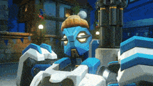 a blue and white robot with the letter r on its face