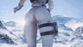 a woman 's butt is shown in front of a mountain range