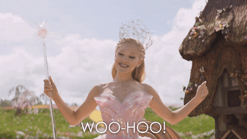 a woman in a pink dress is holding a wand and the words woo-hoo are on the bottom 