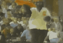 a blurry picture of a person dancing in front of a crowd of people