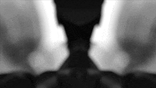 a black and white image of a person 's face
