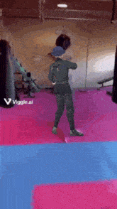 a video of a man dancing in a gym with the words " viggle.ai " on the bottom right