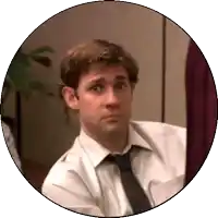 a man in a white shirt and tie looks at something