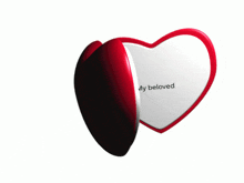 a heart shaped mirror with a picture of a man and the words " my beloved "