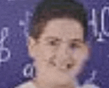 a close up of a young boy 's face in front of a purple background with numbers .