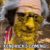 a picture of a man with a yellow face and the words kendrick 's coming on the bottom
