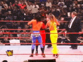 two wrestlers in a ring with a wwe logo