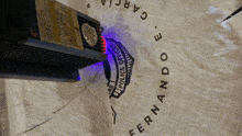 a blue light is shining on a sign that says police officer fernando