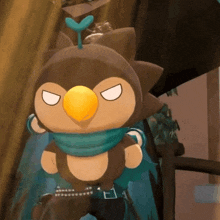 a cartoon character with a yellow beak is wearing a blue scarf