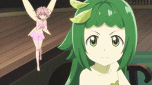 a girl with green hair and leaves on her head stands in front of a pink fairy