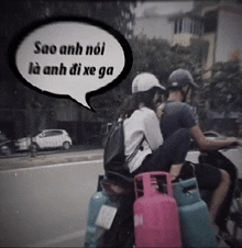 a man and woman riding a motorcycle with a speech bubble that says sao anh noi