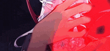 a close up of a person 's hand on a red surface