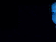 a blurry picture of a man and a woman in a dark room