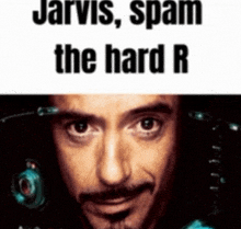 a close up of a man 's face with the words jarvis spam the hard r above him