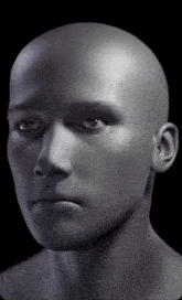 a close up of a mannequin 's head against a black background