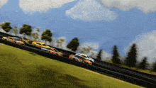 a race car with the word mil on the side is going down a track