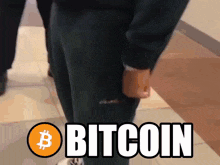 a person walking with the word bitcoin written on their leg