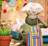 a stuffed animal with a chef 's hat and apron
