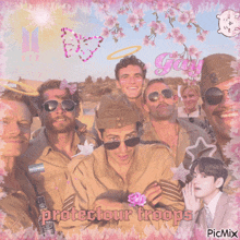 a group of men posing for a picture with protector troops written on the bottom right