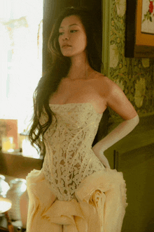 a woman in a white lace corset and gloves