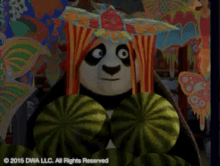 a panda bear holding a fan in front of a colorful background