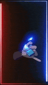 a blue light is coming out of a hand in a dark room
