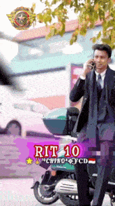 a man in a suit and tie is talking on a cell phone with rit 10 written on the bottom