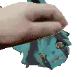 a hand is holding a piece of paper with a face on it