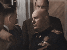 a man in a military uniform has a badge on his chest
