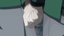 a couple holding hands with a green jacket on