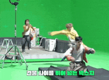 a green screen with korean writing on the bottom right