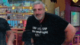 a man wearing a black shirt that says " the midnight "