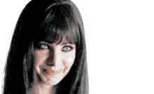 a woman with long black hair and bangs is smiling and making a face .