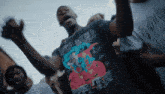a man wearing a t-shirt that says superman on it