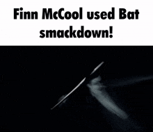a black and white photo of a man holding a bat with finn mcool used bat smackdown written above him