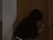 a bed in a dark room with a lamp