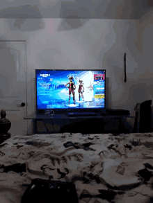 a large flat screen tv shows a game called fortnite