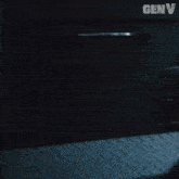 a woman stands in front of a door with genv written on the bottom