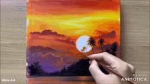 a person is painting a sunset with palm trees and the words wow art on the bottom