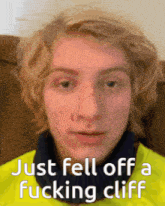 a close up of a person 's face with the words just fell off a fucking cliff above it