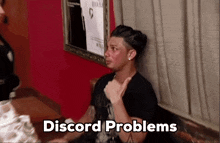 a man sitting on a couch with the words " discord problems " written above him