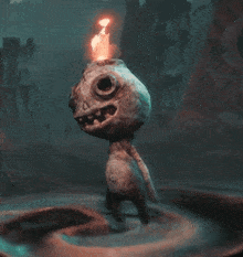 a statue with a torch on top of it
