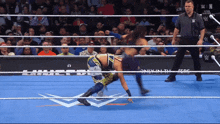 a wrestling match is being shown on a wrestling channel