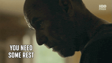 a close up of a man with the words you need some rest below him