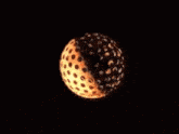 a shirtless man is dancing in front of a disco ball in the dark .