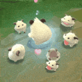 a group of sheep are standing around a heart .