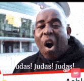 a man with his mouth open and the words udas judas judas gif below him