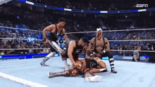 wrestlers in a wrestling ring with the word damn on the bottom